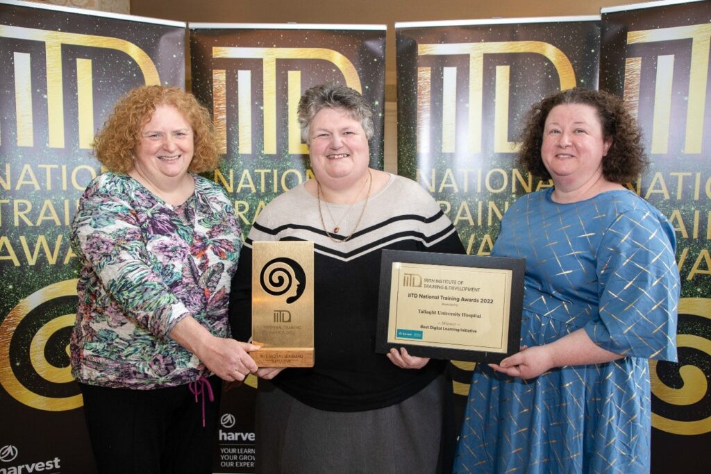 Avril Larke (Centre) Receiving The Irish Institurte of Training & Development Award for Best Digital Learning Initiative 2022. Project manager, Averil Larke, (centre picture), Mary Hickey (L), Quality Improvement Lead & Clodagh McLoughlin (R), Deputy Head of Learning & Development.